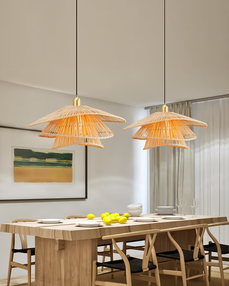 two GLOW 2XL VIETNAMESE Nón Lá RATTAN pendant LIGHTs hanging above a dining table with lemons on a neutral background