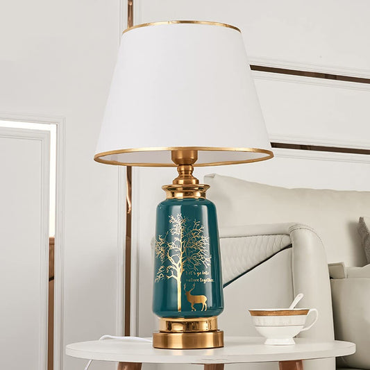 GLOW ART DECO LUXURY LAMP LIGHT with a blue base and gold accents on a white surface.
