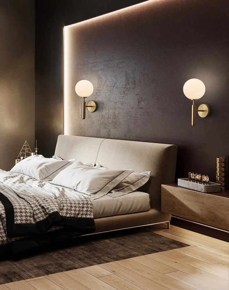 Modern bedroom with a bed, nightstands, and GLOW CRYSTAL BALL LED WALL SCONCE LIGHT