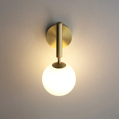 Wall-mounted GLOW CRYSTAL BALL LED WALL SCONCE LIGHT with gold finish and white bulb on a neutral background