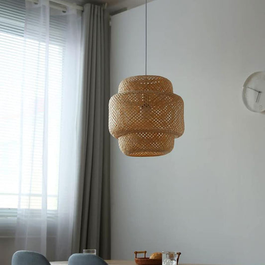 GLOW VENUS FIGURINE RATTAN PENDANT LIGHT hanging in a room with a window and clock on the wall.